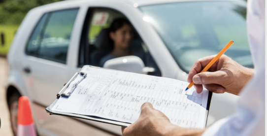 Student preparing for G1 driving test Richmond Hill with handbook and instructor