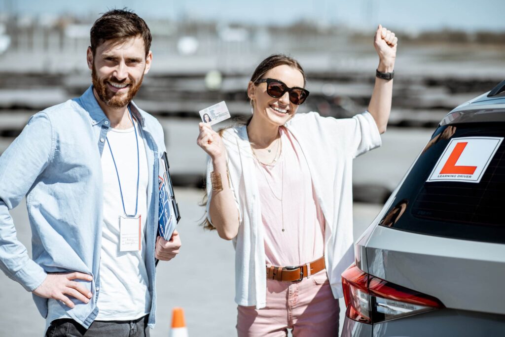 Happy student holding her driver’s license after completing driving lessons in Richmond Hill with Safe Gear Driving School.
